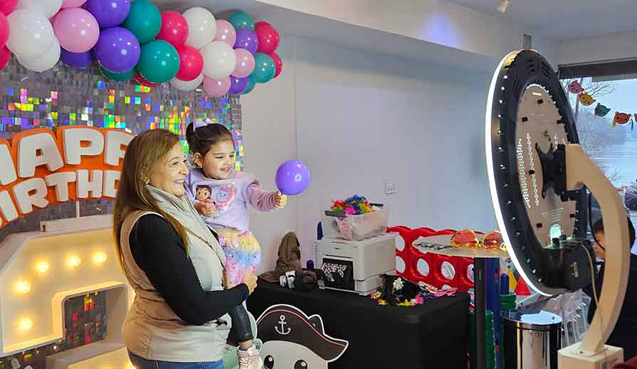 Guests on the 360 photobooth platform having fun